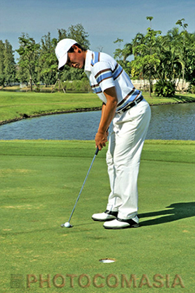 Man playing golf In Thailand golf club
