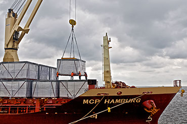 Loading cargo on The Shit In Harbor